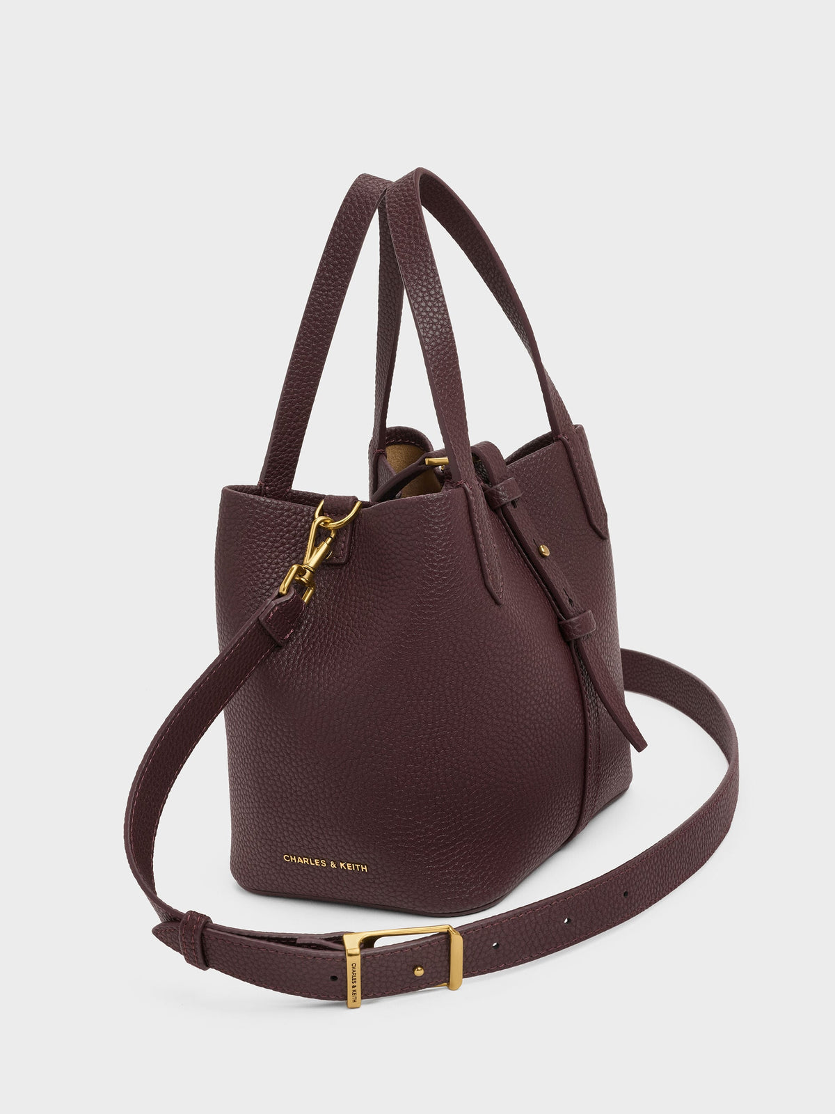 CHARLES & KEITH Trusted | Beryl Belted Bucket Bag - Wineberry Red