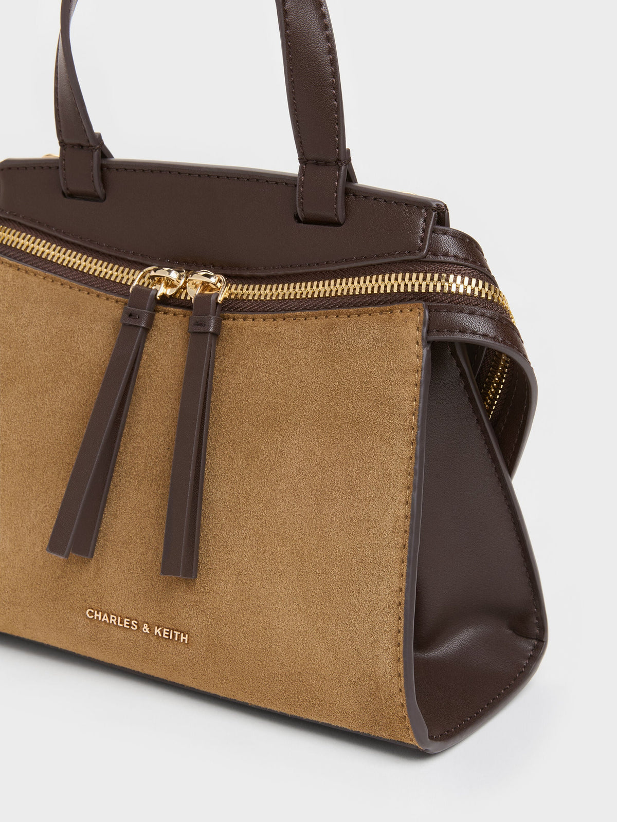 CHARLES & KEITH Deals | Pansy Two-Tone Trapeze Top Handle Bag - Sahara Sand