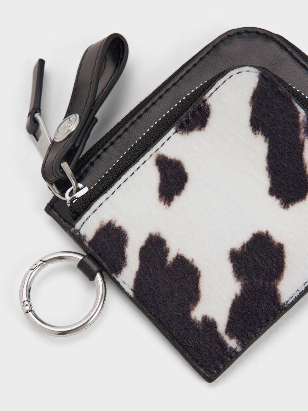 CHARLES & KEITH Popular | Vega Furry Cow-Print Zip-Around Pouch - Multi