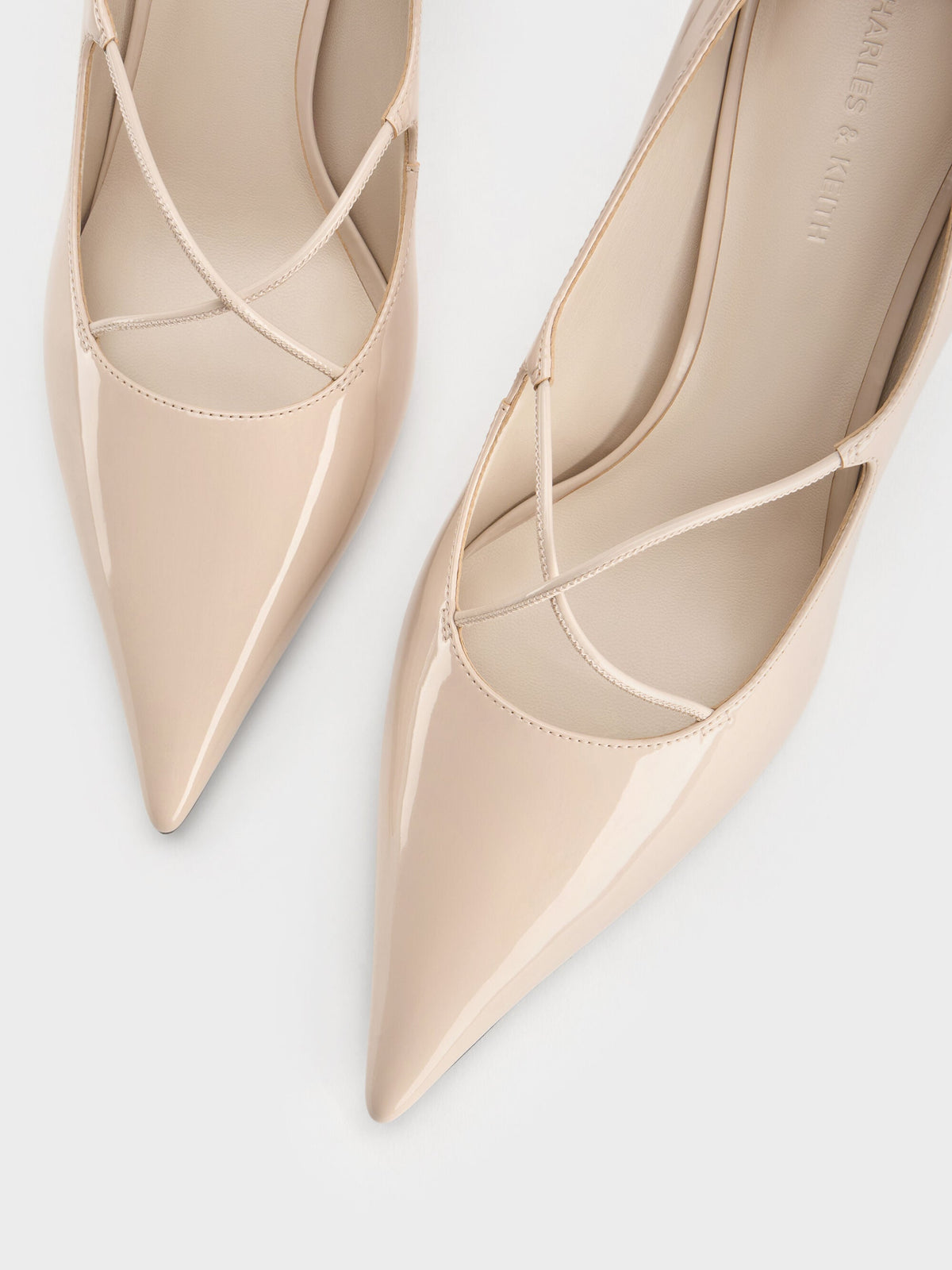 CHARLES & KEITH Signature | Patent Crossover Pointed Pumps - Nude