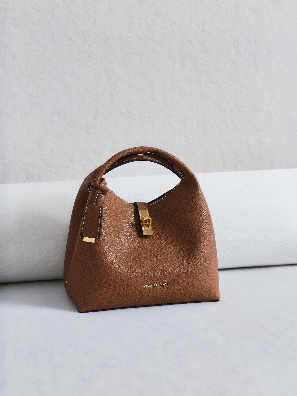CHARLES & KEITH Premium | Chance Turn-Lock Bucket Bag - Chocolate