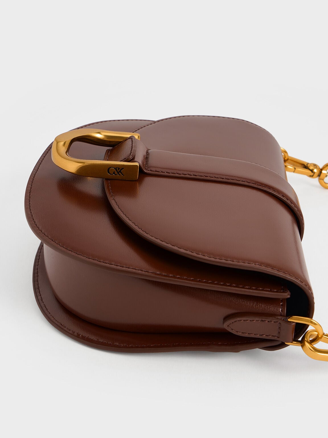 CHARLES & KEITH Essential | Gabine Leather Saddle Bag - Dark Brown