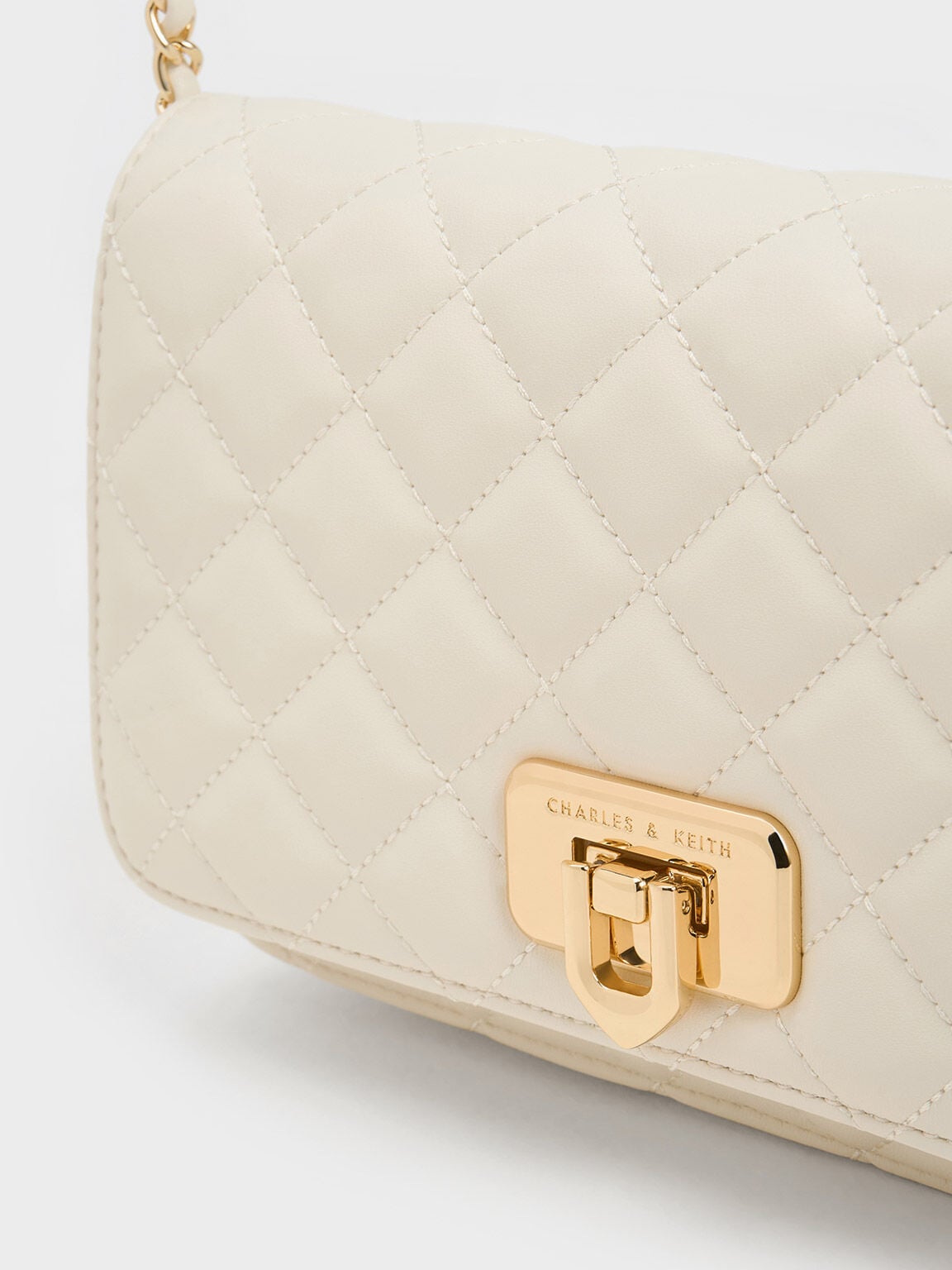 CHARLES & KEITH Top Pick | Cressida Quilted Push-Lock Clutch - Cream