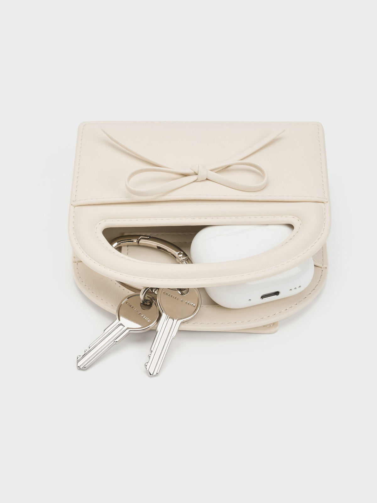 CHARLES & KEITH Latest | Reese Bow Top Handle Wristlet - Cream