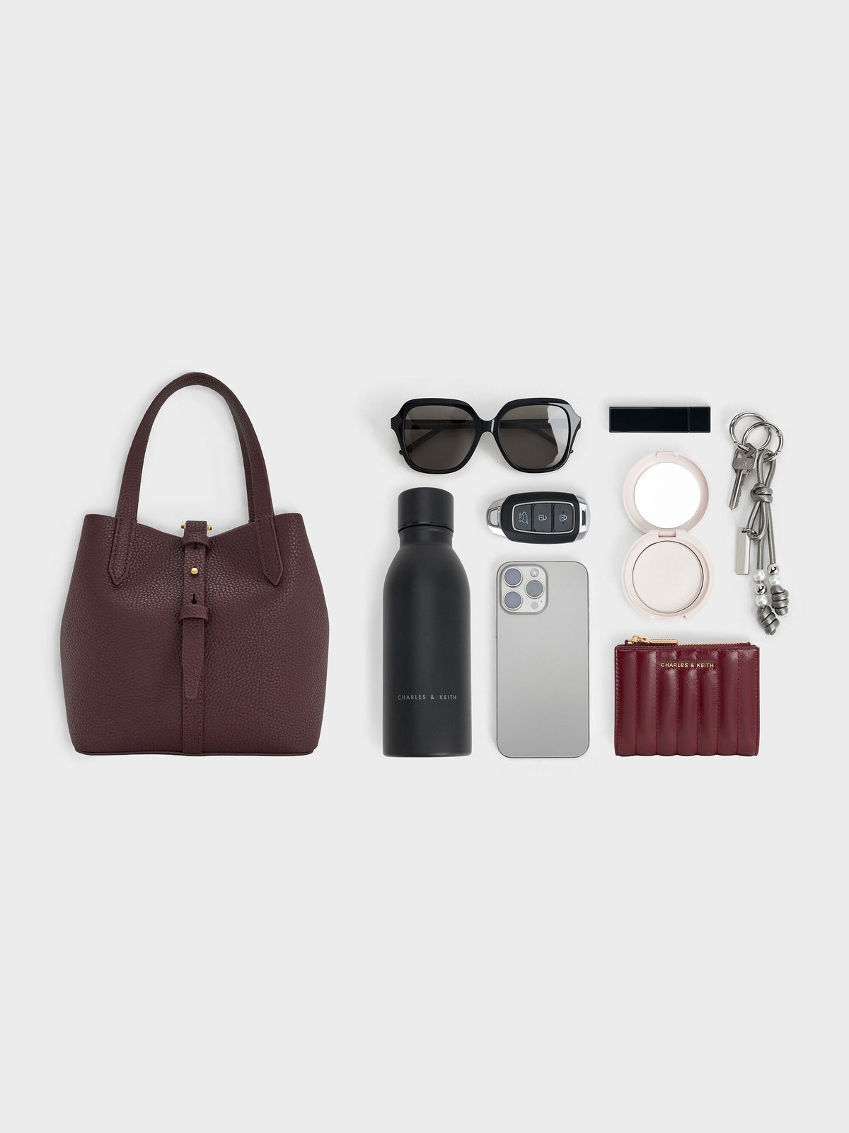 CHARLES & KEITH Trusted | Beryl Belted Bucket Bag - Wineberry Red