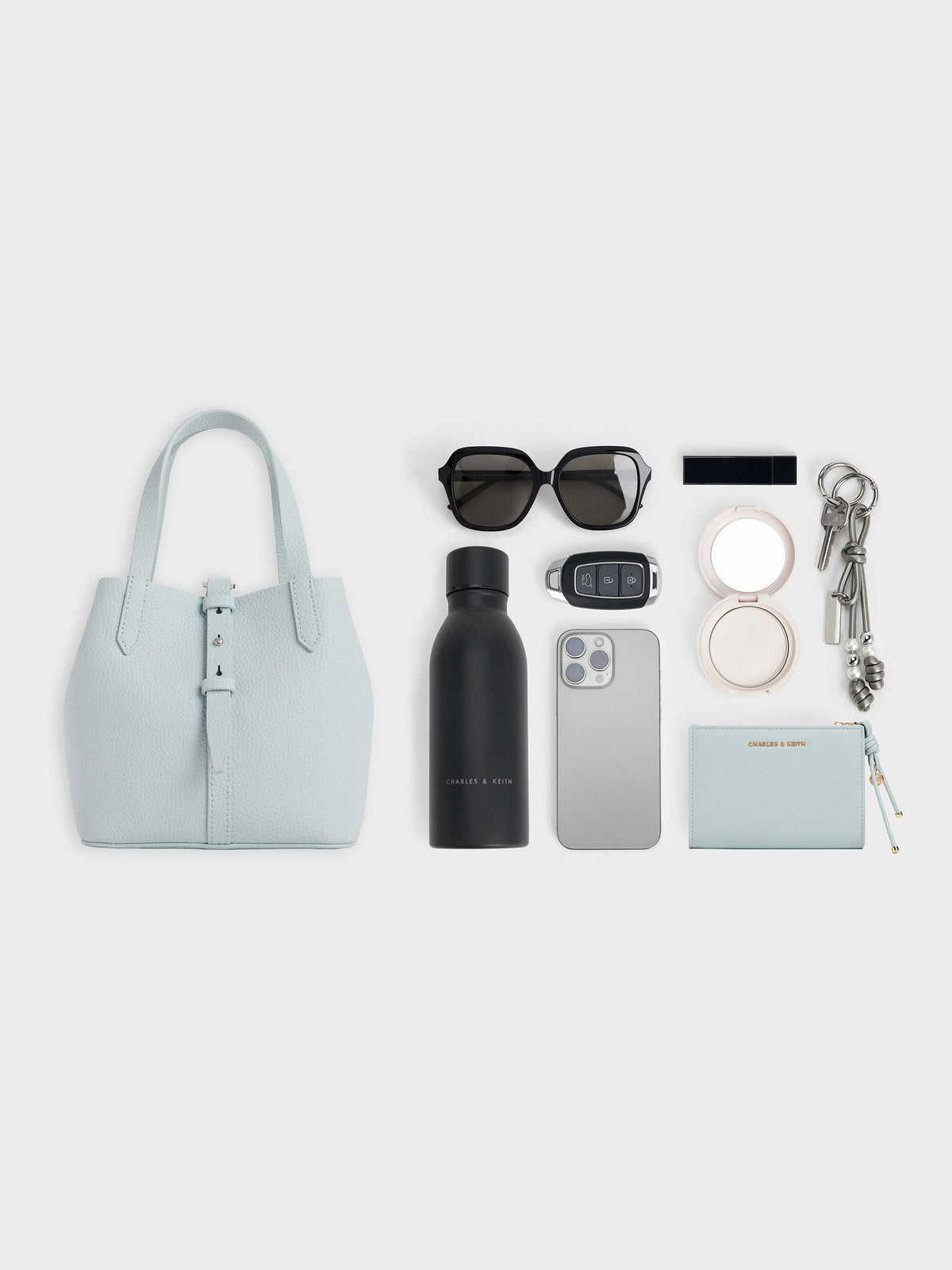 CHARLES & KEITH Deals | Beryl Belted Bucket Bag - Sea Salt Blue