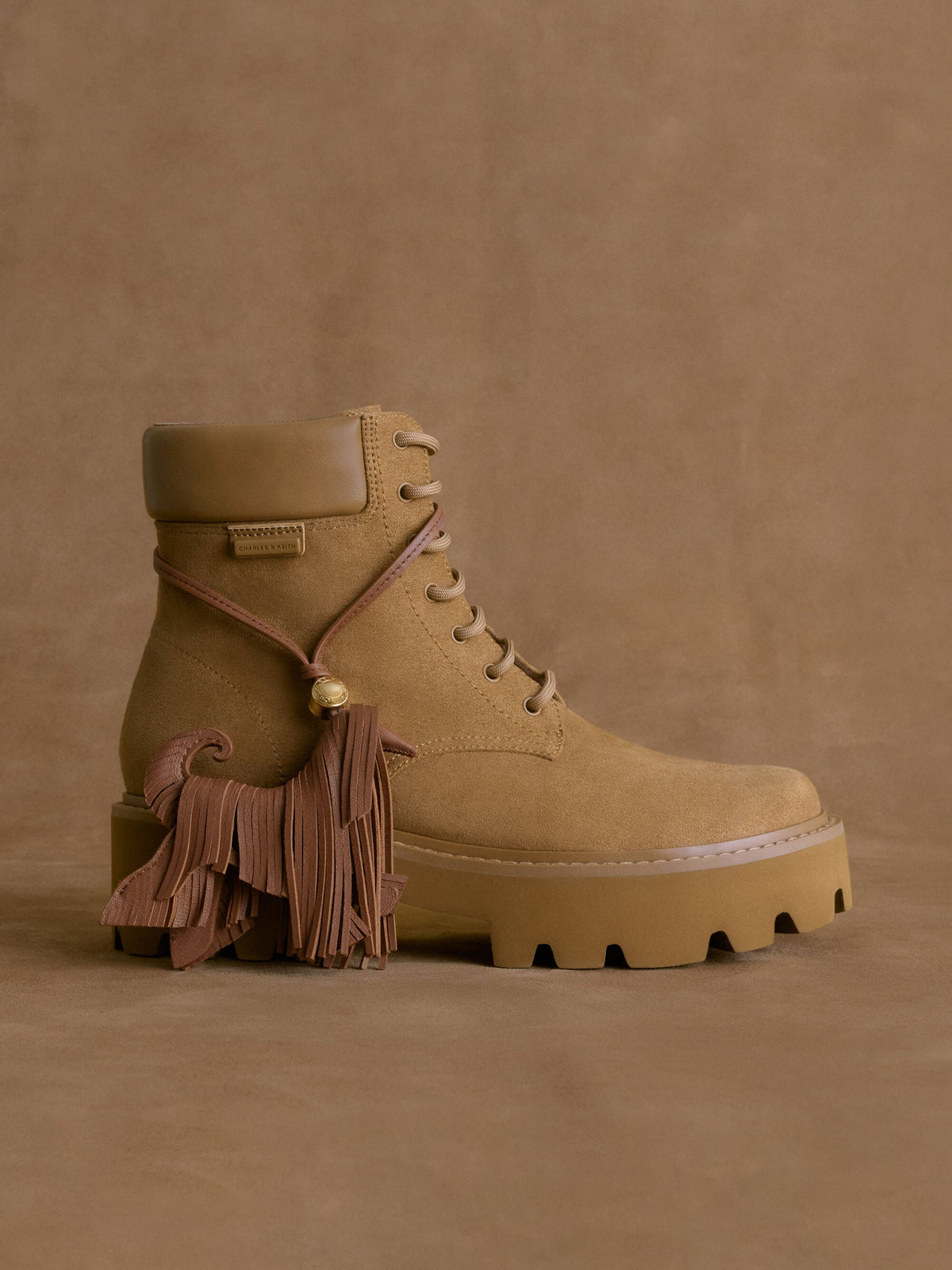 CHARLES & KEITH Customer Favorite | Leather Fringed Dog Charm - Chocolate