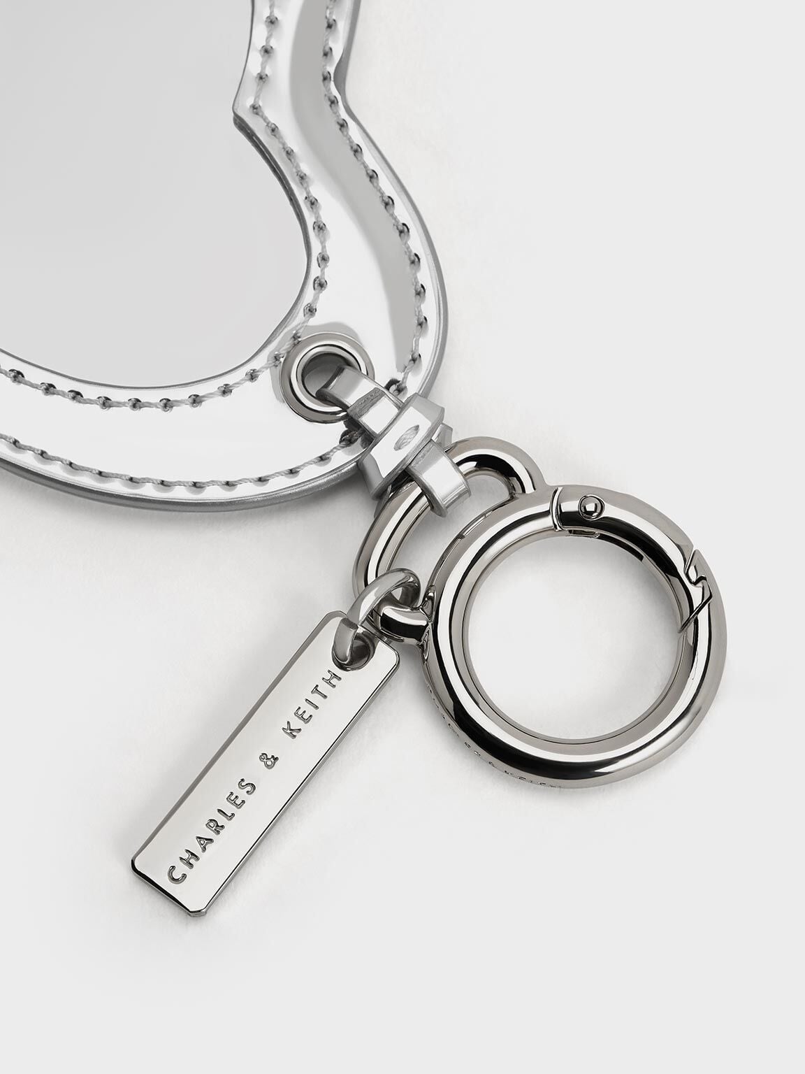 CHARLES & KEITH Best Seller | Metallic Heart Quilted Mirror Charm - Silver